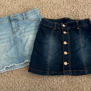 Two denim skirts with adjustable waist.